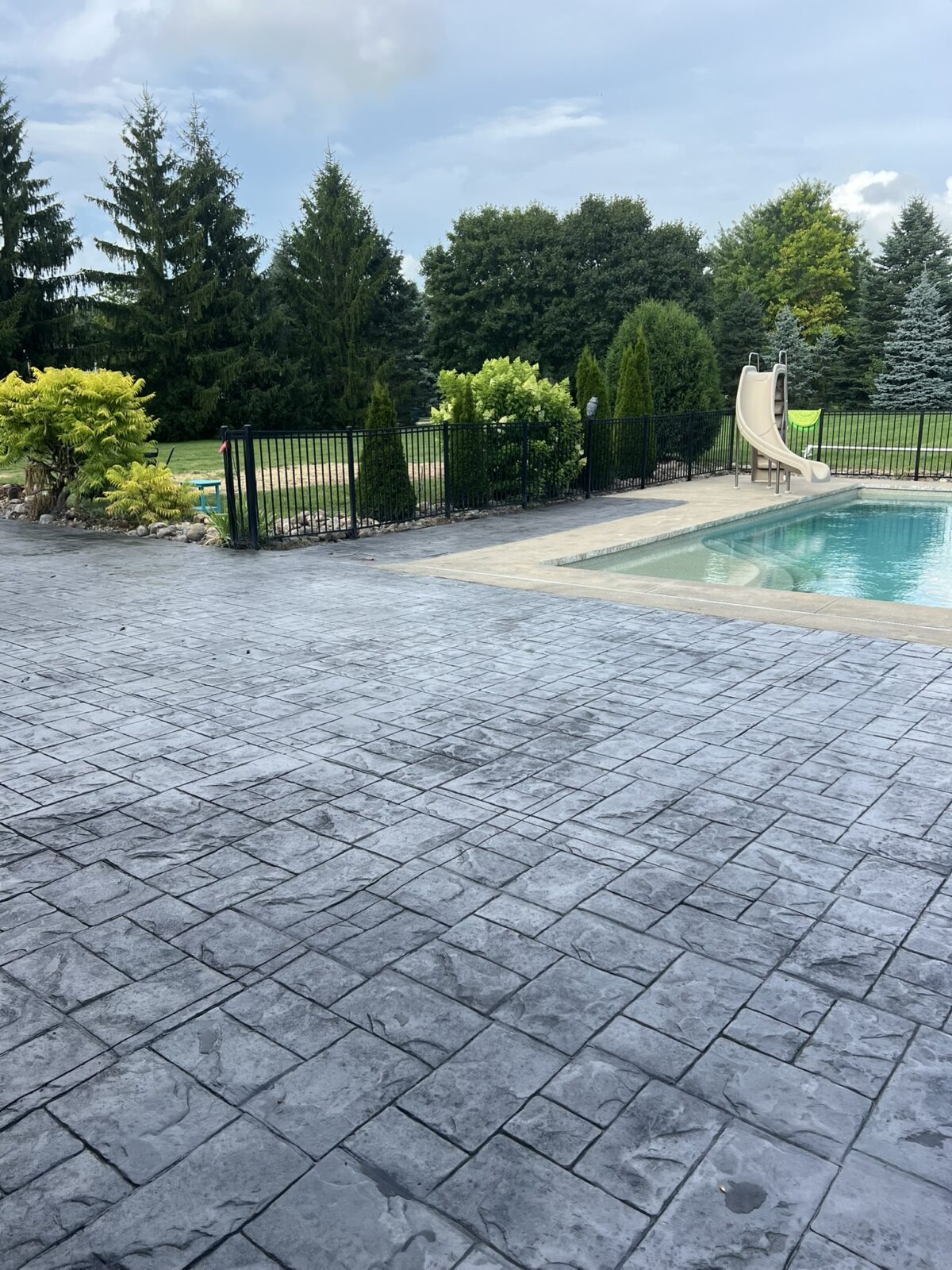 stamped-concrete-for-pool-area, black pearl, stamped concrete, stamped concrete contractor, stamped concrete in novi, stamped concrete contractors in novi